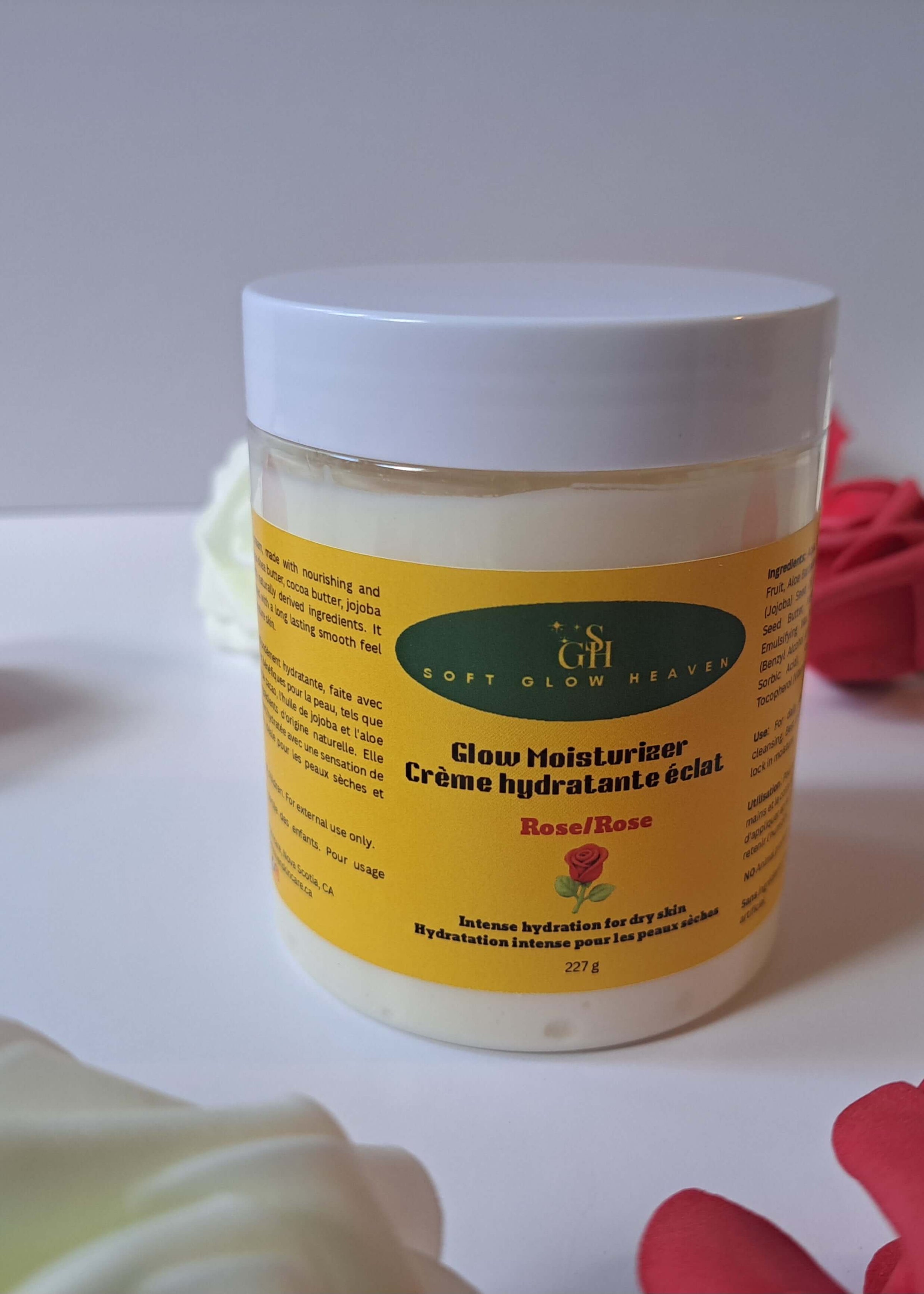 Hydrating skin cream with shea butter in a jar with a yellow label among roses.